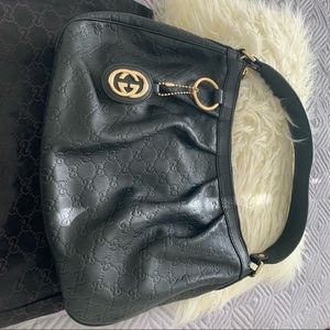Authentic Gucci black leather Guccissima in great hardly used condition.